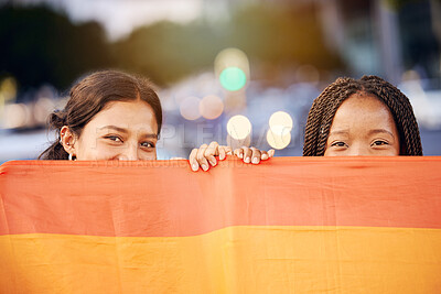 Buy stock photo Love, pride flag and portrait of a lesbian couple at a LGBTQ, freedom or community parade in the city. Happy, celebration and interracial gay women with commitment at a LGBT, rainbow sexuality event.