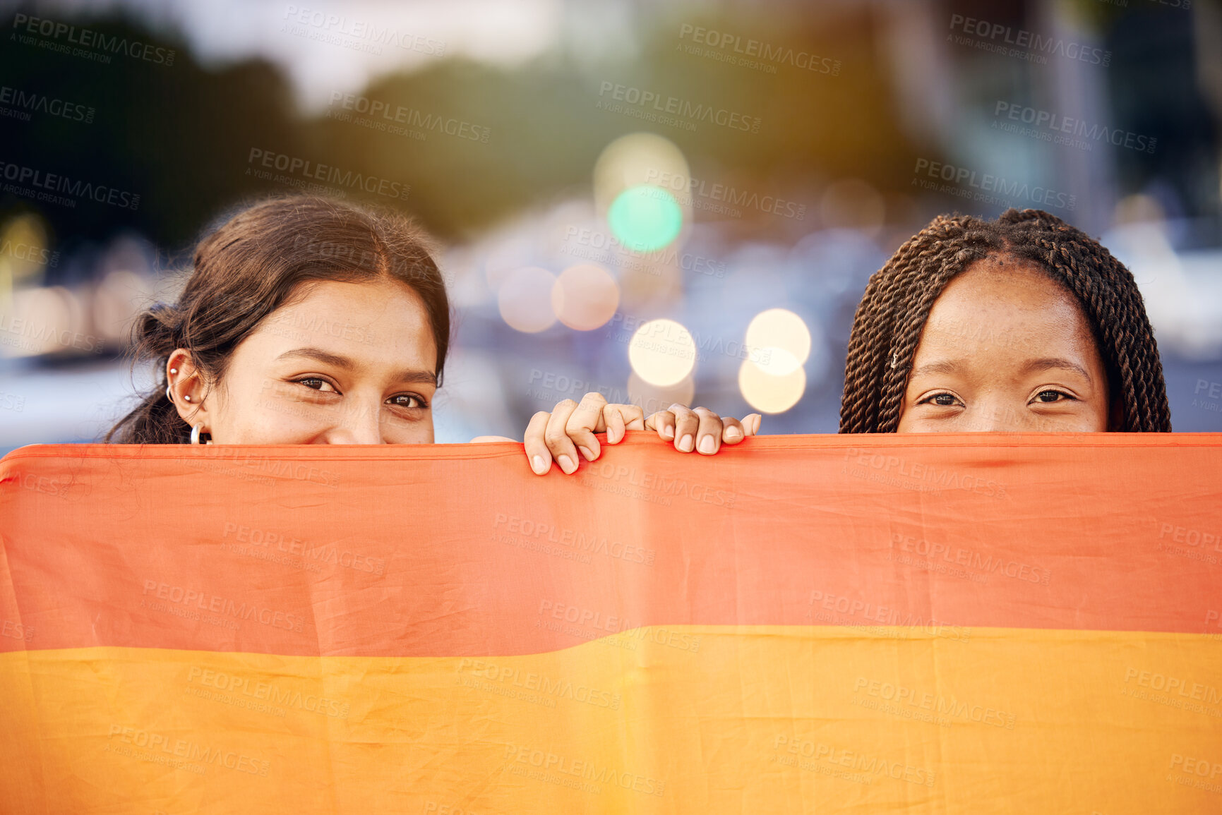 Buy stock photo Love, pride flag and portrait of a lesbian couple at a LGBTQ, freedom or community parade in the city. Happy, celebration and interracial gay women with commitment at a LGBT, rainbow sexuality event.
