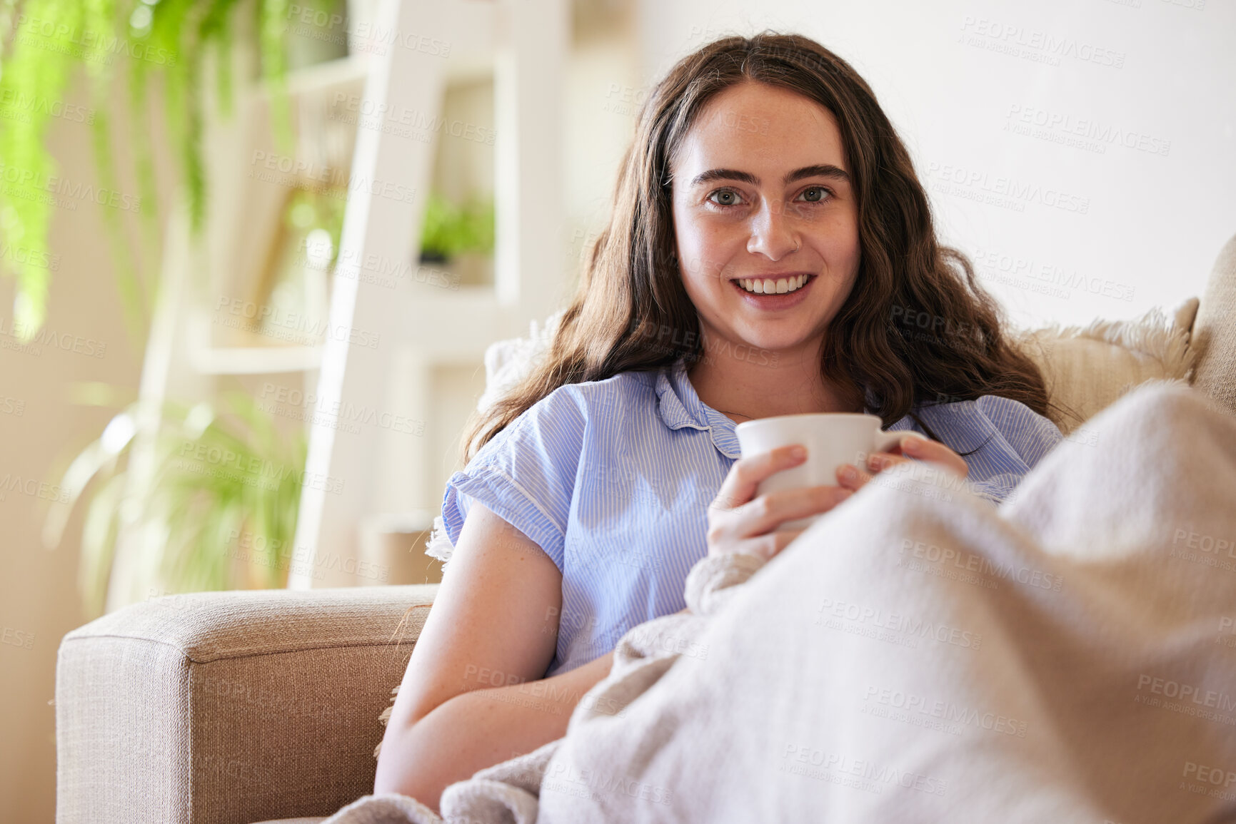 Buy stock photo Happy woman, portrait and drinking coffee on couch, sofa and relax in living room, lounge and apartment in Sweden. Young girl at home enjoy cup of tea, peace and freedom in morning with warm beverage