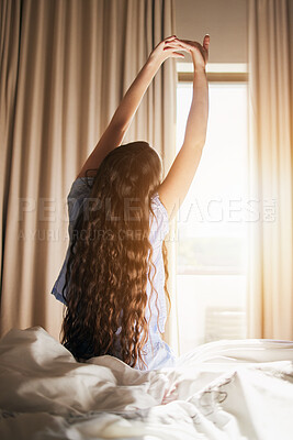 Buy stock photo Morning, wake up and a woman stretching in the bedroom of her home after sleeping or rest on the weekend. Back, bright and flare with a female sitting on a bed while waking with an early stretch