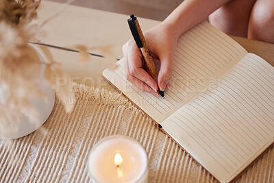 Buy stock photo Hand, candle and woman writing in journal with top view for calm, peace mindset and relax morning routine in home. Hands, notebook and diary planning goals, idea vision or creative writer lifestyle 