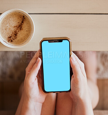 Buy stock photo Coffee, phone and hands of girl with green screen mock up at home to relax with online app zoom. Streaming, social media or news advertising screen with smartphone and drink of woman on internet

