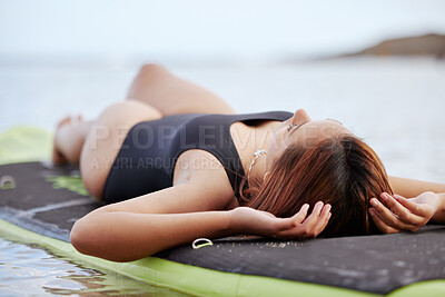 Buy stock photo Relax, woman or surfer on water at a beach on holiday vacation resting on a surfboard in Bali. Freedom, thinking or healthy sports girl relaxing body in calm nature, sea or peaceful ocean in summer