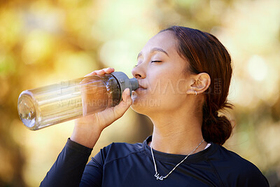 Buy stock photo Fitness, nature and woman drinking water after running for hydration, refresh and thirst. Sports, runner and female athlete enjoying a drink after cardio training for a race, marathon or competition.