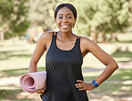 Portrait of black woman in park with yoga mat and smile in nature for health and fitness mindset and care. Exercise, zen and yoga, happy face on woman ready for pilates workout on grass in summer sun