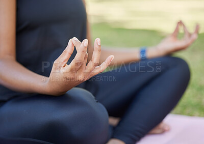 Buy stock photo Hands, meditation and yoga with a black woman on an exercise mat outdoor in nature for health or wellness. Fitness, park and summer with a female athlete or yogi meditating outside for balance