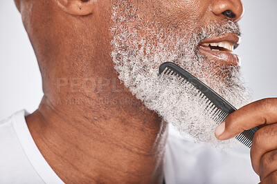 Buy stock photo Elderly, black man with comb for beard, beauty and grooming closeup with face hygiene and cosmetic care profile. Hair care, brush body hair and treatment with cosmetics against studio background