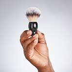 Hand, brush and shaving with beauty and black man, hygiene and grooming with skincare mockup. Shave, body hair care and cosmetic tools marketing with barber equipment against studio background