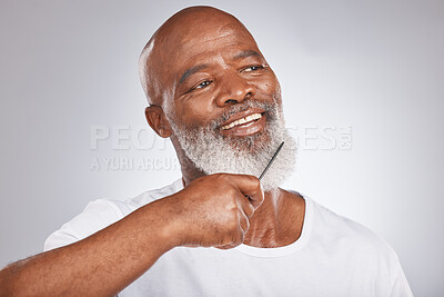 Buy stock photo Elderly, black man with comb for beard, beauty and grooming with hygiene and cosmetic care against studio background. Facial hair mockup, brush body hair and male face, hair treatment and cosmetics
