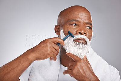 Buy stock photo Face, shaving cream and black man with razor on beard, skincare spa treatment on grey background. Health, mock up and facial hair, mature man morning shave routine with space for product placement. 