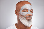 Skincare, beauty or senior black man with face mask marketing or advertising a luxury beauty product for self care. Studio background, facial cosmetics or African old man relaxing with a happy smile 