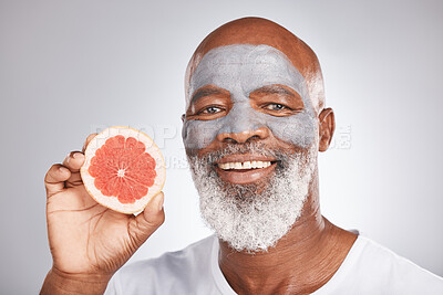 Buy stock photo Beauty, grapefruit or happy old man with face mask marketing or advertising skincare or healthy diet. Studio background, fruit or senior black man with a happy smile grooming with natural cosmetics 