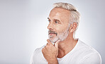 Face, thinking and senior man in studio isolated on a gray background mock up. Skincare, cosmetics and retired elderly male lost in thoughts or contemplating ideas for beauty, grooming and wellness.