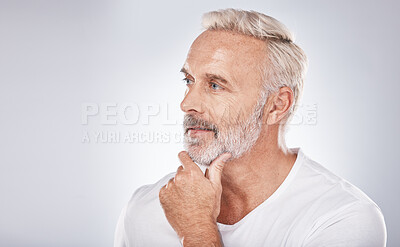 Buy stock photo Face, thinking and senior man in studio isolated on a gray background mock up. Skincare, cosmetics and retired elderly male lost in thoughts or contemplating ideas for beauty, grooming and wellness.