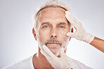 Man face, hands or cosmetic surgery gloves on studio background for skincare collagen, medical dermatology or anti aging grooming. Portrait, plastic surgeon or mature patient check for facial change