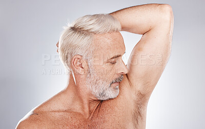 Buy stock photo Grooming, hygiene and man with fresh armpits, smelling clean and wellness after shower on a studio background. Healthcare, skincare and cosmetics senior model with underarm smell after cleaning body
