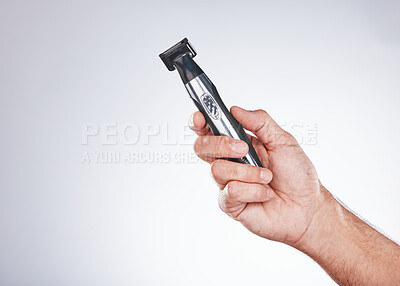 Buy stock photo Hand, razor and hair removal with beauty and man with grooming mockup, hygiene and body hair care against studio background. Shaving, electric shaver and cosmetic tools product with face care