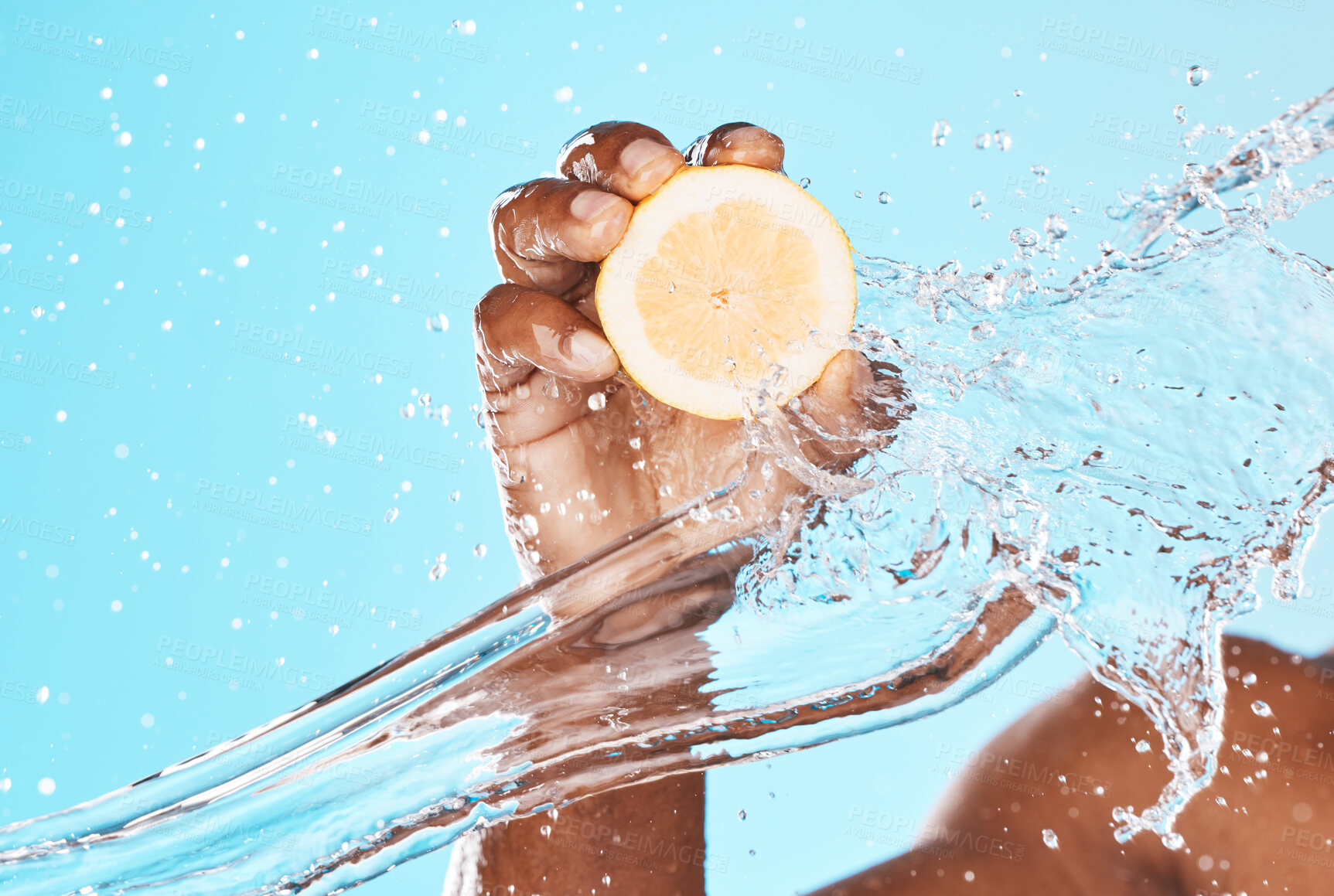 Buy stock photo Water splash, lemon and man beauty with hands for healthy skincare, wellness and dermatology. Vitamin c, citrus fruits and shower on blue background for natural diet, water drops and detox cosmetics 