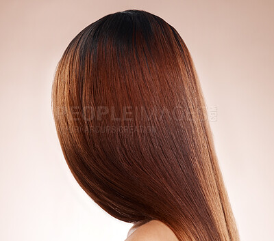 Buy stock photo Salon, hair and back of woman in studio for hair care, hair products and cosmetics on beige background. Beauty, balayage and girl with healthy, shine and long hair for hair salon, treatment and glow