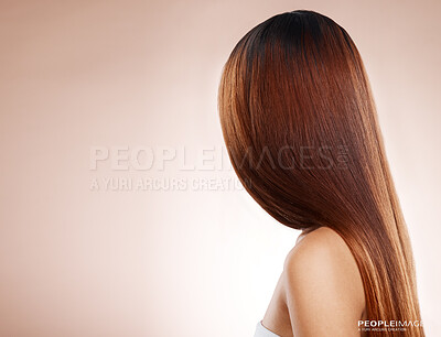 Buy stock photo Salon, hair and back of woman in studio for hair care, hair products and cosmetics on beige background. Beauty, balayage and girl with healthy, shine and long hair for hair salon, treatment and glow