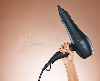 Buy stock photo Hand, hair dryer and salon mockup of appliance, tool or equipment for haircare against a studio background. Hands holding electrical blow dryer for marketing or advertising hair products or cosmetics