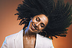 Hair, afro and black woman, beauty with smile on face and cosmetic and hair care with happiness against studio background. Dance, natural curly hair texture and makeup with earrings and freedom