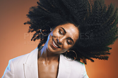 Buy stock photo Hair, afro and black woman, beauty with smile on face and cosmetic and hair care with happiness against studio background. Dance, natural curly hair texture and makeup with earrings and freedom