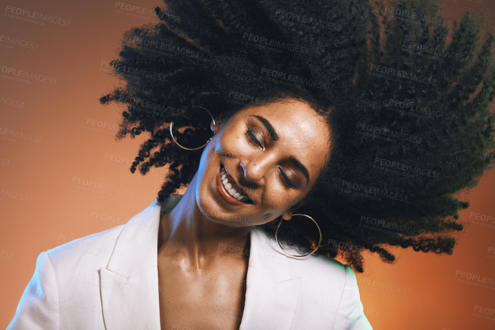 Buy stock photo Hair, afro and black woman, beauty with smile on face and cosmetic and hair care with happiness against studio background. Dance, natural curly hair texture and makeup with earrings and freedom