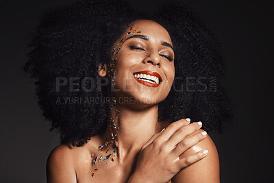 Woman rhinestones, face or body art jewels on black background studio in  fashion sparkle, festival accessory or creative party crystals. Happy  smile, afro or beauty model skin or makeup cosmetic gems