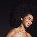 Woman face, fashion body art or rhinestone jewels on black background studio for diamond sparkle, festival accessory or creative party crystal. Happy smile, beauty model skin or makeup cosmetics gems