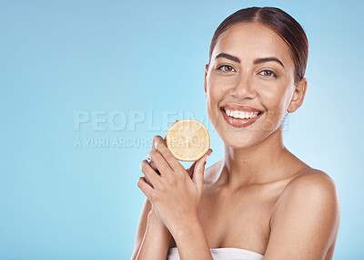 Buy stock photo Wellness, facial and lemon portrait of girl with natural smile and healthy glow for marketing. Beauty, skincare and self care model with fruit for cosmetic advertising in blue studio mockup.

