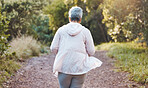Fitness, exercise and senior woman on nature trail for running, cardio and a workout for health and wellness outdoor. Elderly female in a forest to run for a healthy lifestyle, body and energy