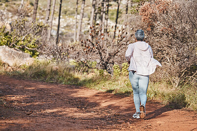 Buy stock photo Fitness, runner or old woman running in nature training, exercise or cardio workout in New Zealand. Back view, wellness or healthy senior person exercising with resilience, body goals or motivation