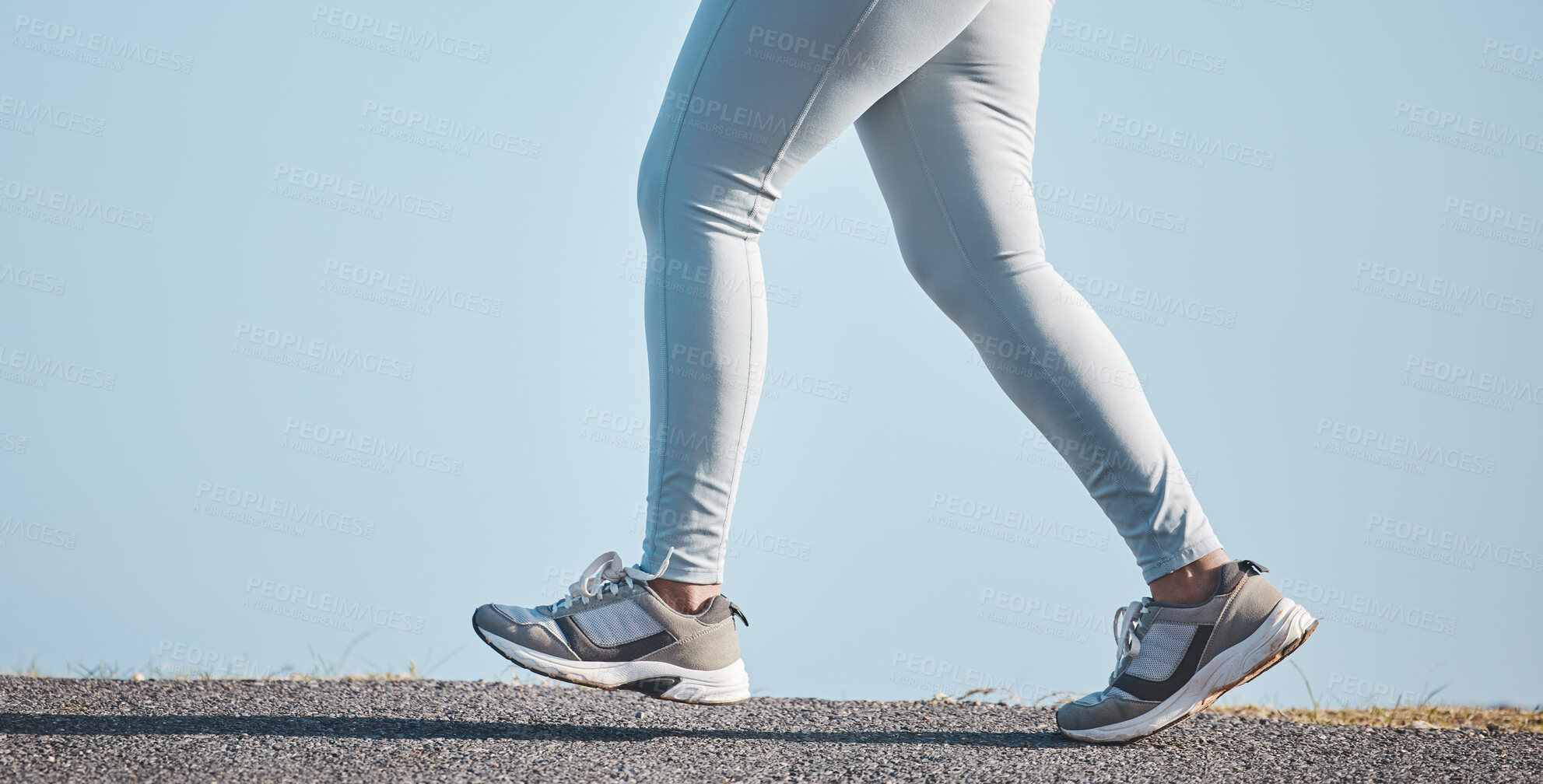 Buy stock photo Fitness, nature and legs of a woman running for health, wellness and endurance training in the street. Sports, workout and female athlete doing a  cardio exercise for a race, marathon or competition.