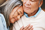 Love, relax and elderly couple hugging, bonding and spending quality time together at their home. Affection, romance and senior man and woman in retirement embracing with care at their house.