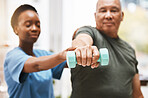 Medical, training and physiotherapy with dumbbell and old man with nurse for rehabilitation, support and retirement. Healthcare, help and physical therapy with patient and black woman in nursing home