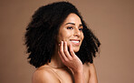 Black woman, smile and studio with beauty, makeup and cosmetic wellness with hands, face glow and afro hair. Model, skin health and facial cosmetics, self care and aesthetic by brown studio backdrop