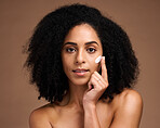 Skincare, cream and black woman in portrait for facial, beauty and cosmetics promotion of product in studio. African model with skin care, dermatology or sunscreen application on face