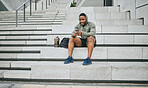 Social media, phone or black man on steps after fitness training, exercise or workout with a sports bag in Miami, Florida. Social networking, happy or healthy athlete texting, chat or typing online 
