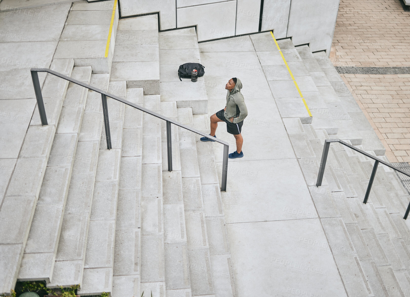 Buy stock photo Fitness, tired or black man walking on stairs for training, exercise or cardio workout in Chicago, USA. Mission, mindset or healthy athlete in hoodie thinking of sports goals or breathing on steps