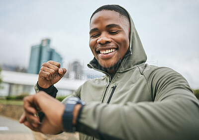 Buy stock photo Fitness, goal and black man reading watch for training progress, running celebration and exercise success in Nigeria. Monitor, celebrate and runner happy with cardio performance on smart watch