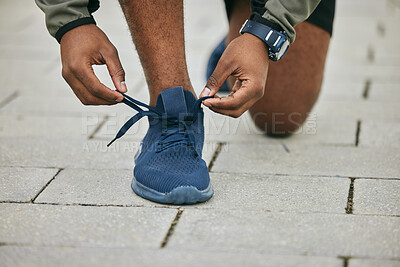Buy stock photo City, hands and black man tie shoes and preparing for running, workout or exercise. Wellness, sports fitness and male runner tying sneaker lace and getting ready for training jog on street outdoors.