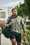 Exercise, black man and walking with water bottle, for training and workout for wellness, fitness and health. African American male, athlete or bodybuilder ready for practice, motivation or hydration