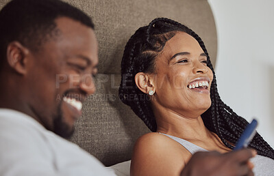 Buy stock photo Happy, love and black couple on a smartphone in bed browsing on social media, mobile app or internet. Happiness, cellphone and African man and woman laughing, talking and bonding together in bedroom.