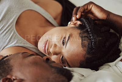Buy stock photo Black couple, love and bedroom romance while happy and intimate on a bed at home, apartment or hotel to relax. Face of a young man and woman in a happy marriage with commitment, trust and care