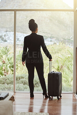 Buy stock photo Travel, luggage and glass with a business black woman standing in a hotel looking at the view. Corporate, window and accommodation with a female employee in a luxury or modern apartment for work