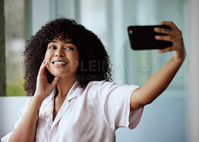 Buy stock photo Selfie, beauty and skincare with a black woman taking a picture in the bathroom of her home in the morning. Facial, phone and influencer with an attractive female posing for a social media photograph