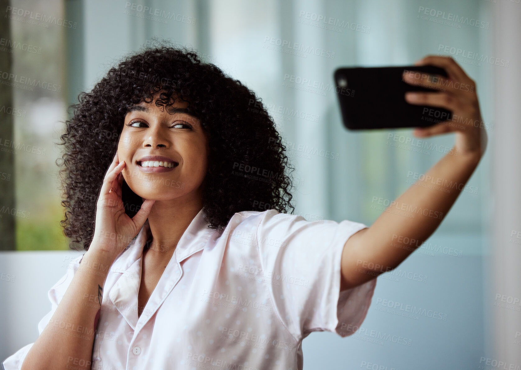 Buy stock photo Selfie, beauty and skincare with a black woman taking a picture in the bathroom of her home in the morning. Facial, phone and influencer with an attractive female posing for a social media photograph