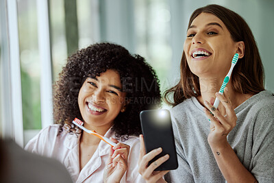 Buy stock photo Brushing teeth, happy and friends with a phone photo of morning routine, dental cleaning and healthy together. Funny, playful and women with smile for oral care, toothbrush and mobile picture