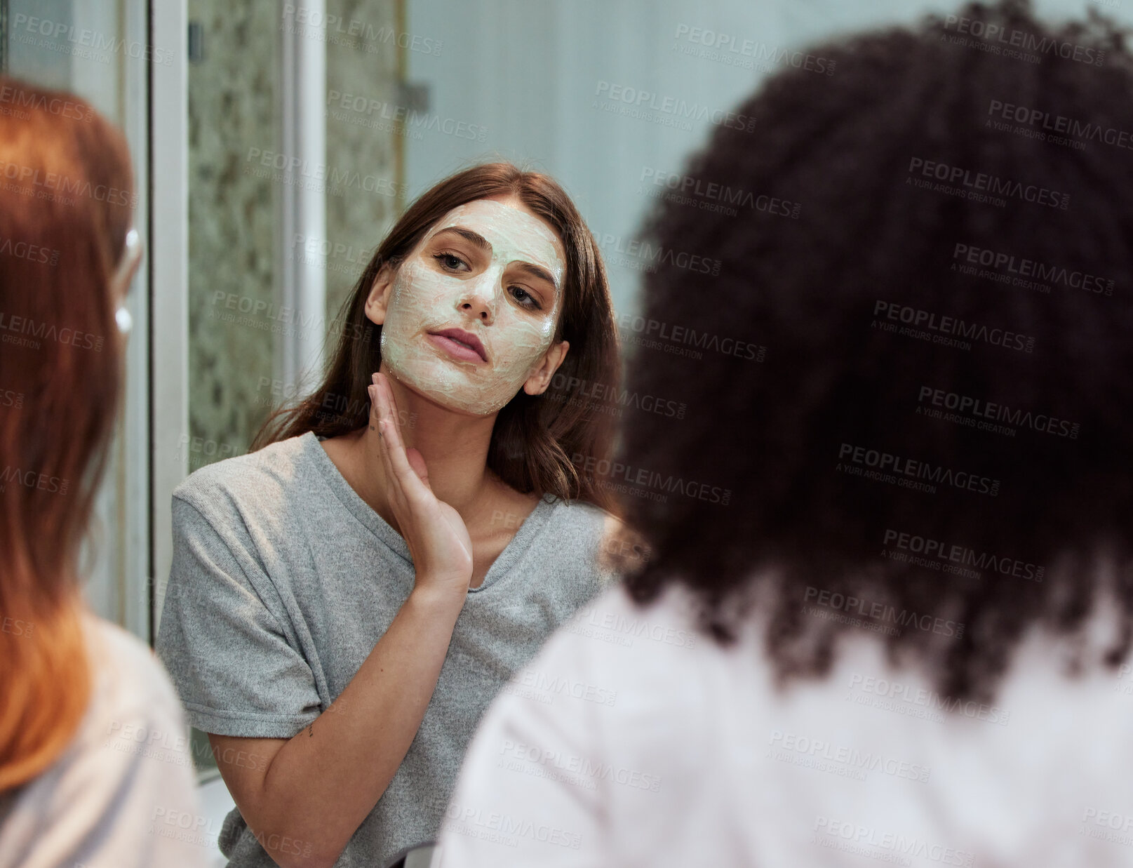 Buy stock photo Women, bathroom skincare or face mask bonding in house, home and hotel spa wellness, girls hospitality or healthcare grooming. Friends, people or beauty facial product for wellness cleaning in mirror